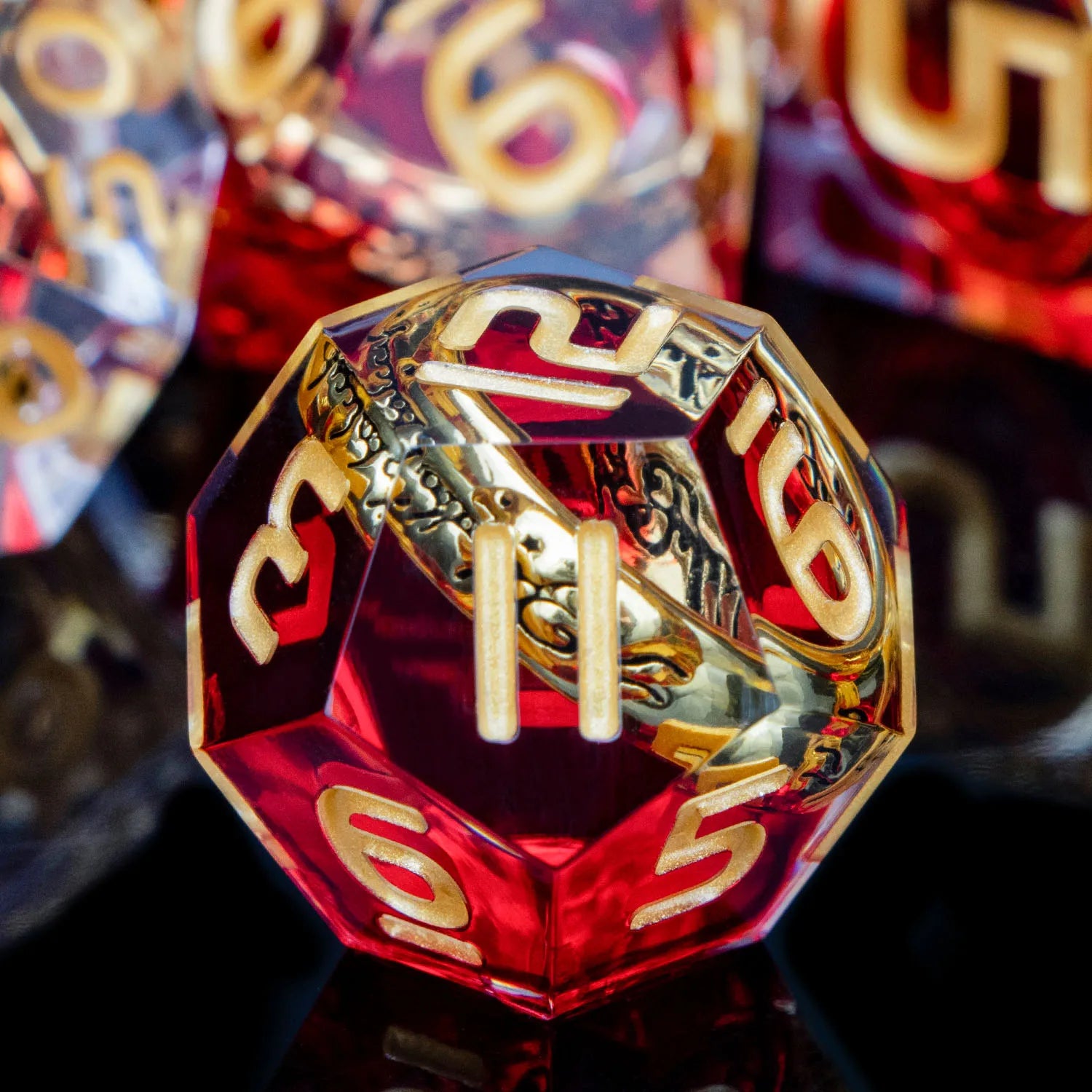 Transparent red dice with gold numbers and gold rings inside