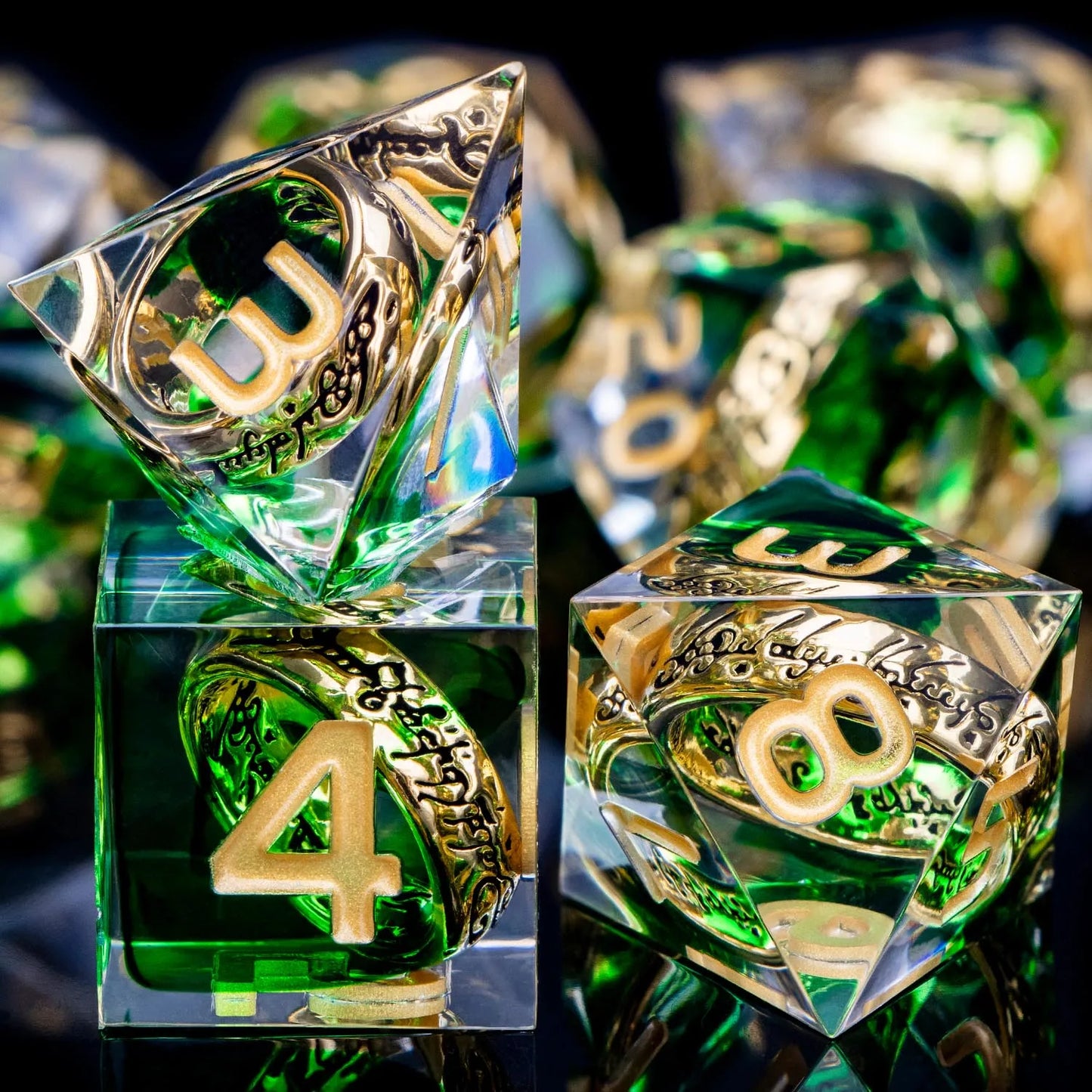 Transparent green dice with gold numbers and gold rings inside