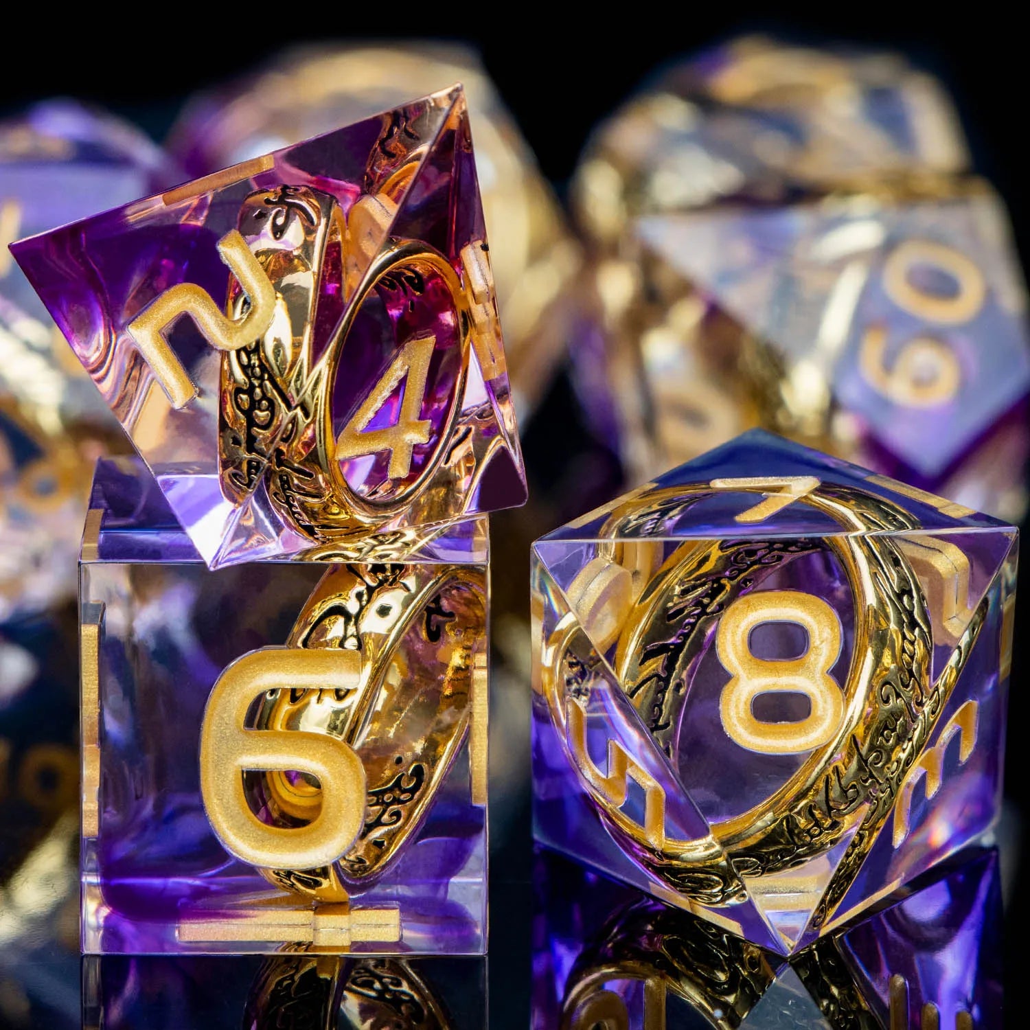 Transparent purple dice with gold numbers and gold rings inside