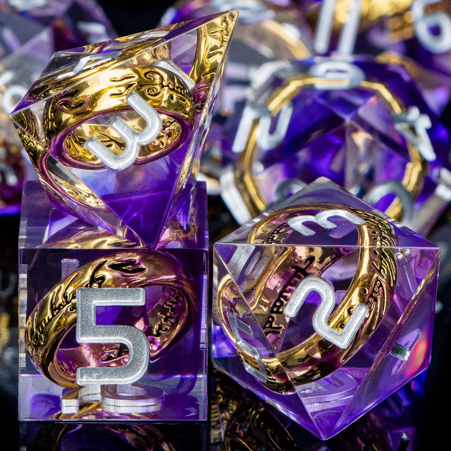 Transparent purple dice with white numbers and gold rings inside